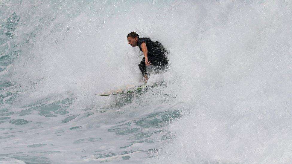 A surfer tackles the waves as large seas pound the coast at Bronte Beach in Sydney on 6 March, 2017