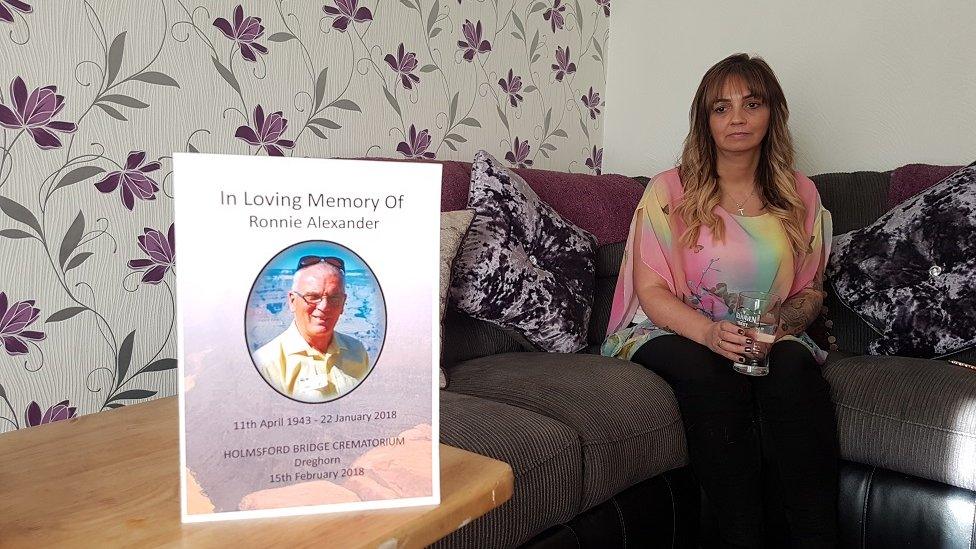 Tracy Fraser with a picture of her dad, Ronnie Alexander.