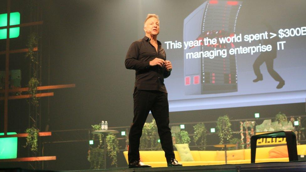 Michael Baum on stage at a tech event