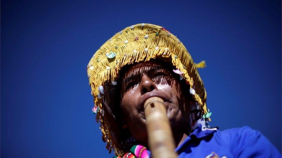 A supporter plays a wind instrument during Bolivia"s former President Evo Morales"s caravan between Uyuni and Oruro, upon his return to the country, in Uyuni, Bolivia November 10, 2020.