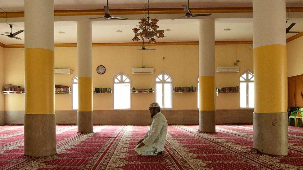 A Muslim devotee attends a prayer on the first day of the holy month of Ramadan during a government-imposed nationwide lockdown in Kathmandu