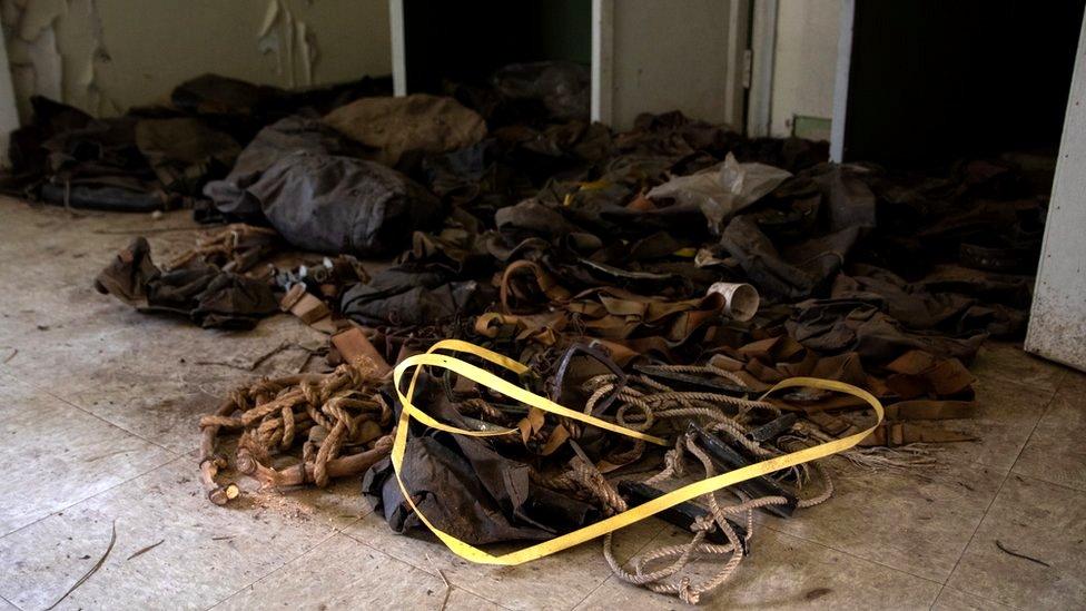 Webbing, belts, pouches and packs strewn on the floor