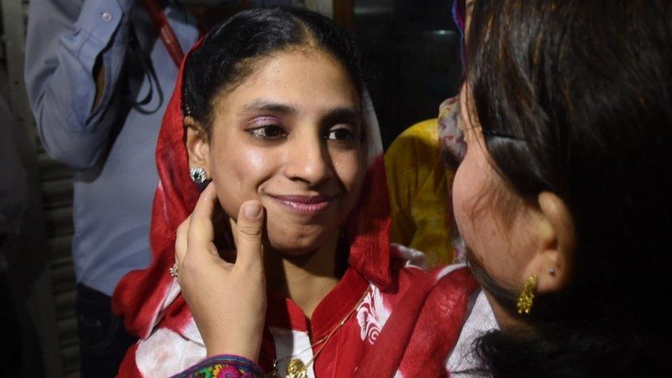 Deaf-mute Indian woman, Geeta meets with friends before leaving for the airport from the EDHI Foundation in Karachi on October 26, 2015.