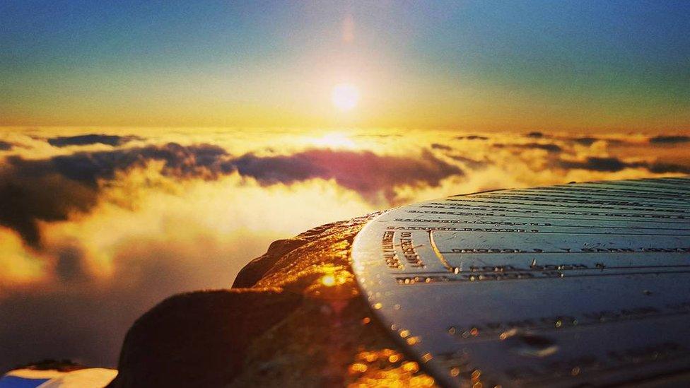 Summit of Snowdon with the sun rising