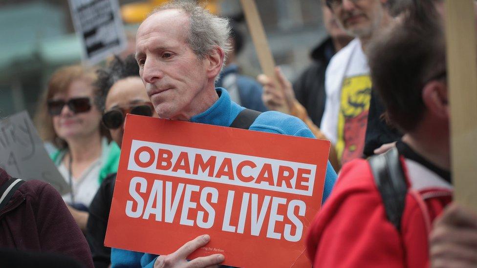 Demonstrators gather near Trump Tower to celebrate the defeat of President Donald Trump's revision of the Affordable Care Act (ACA) on March 24, 2017 in Chicago, Illinois