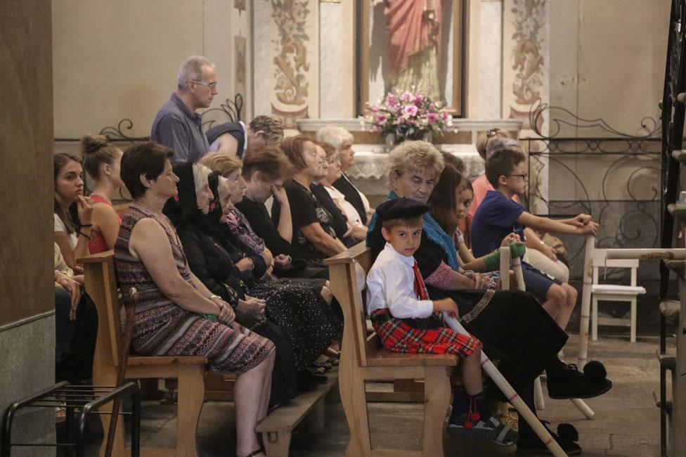 Boy wearing tartan in church