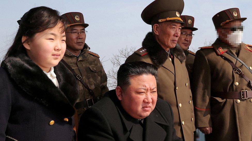 North Korean leader Kim Jong Un and his daughter Kim Ju Ae watch a missile drill at an undisclosed location in this image released by North Korea's Central News Agency (KCNA) on March 20, 2023.