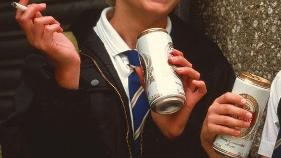 Schoolchildren drinking beer