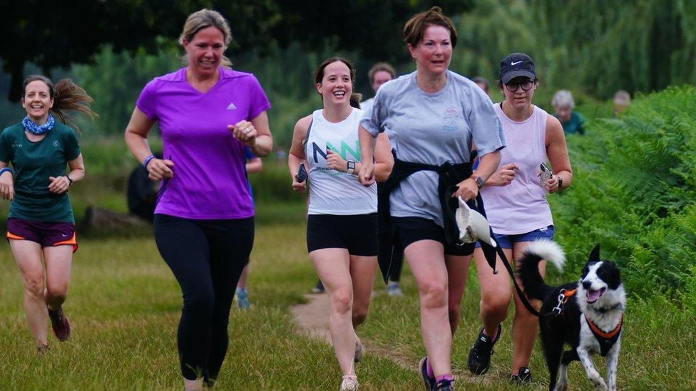 A dog joined runners at Bushy Park