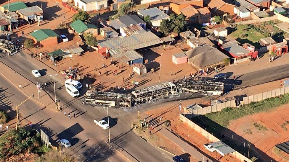 Aerial view of burnt-out buses near Pretoria, South Africa