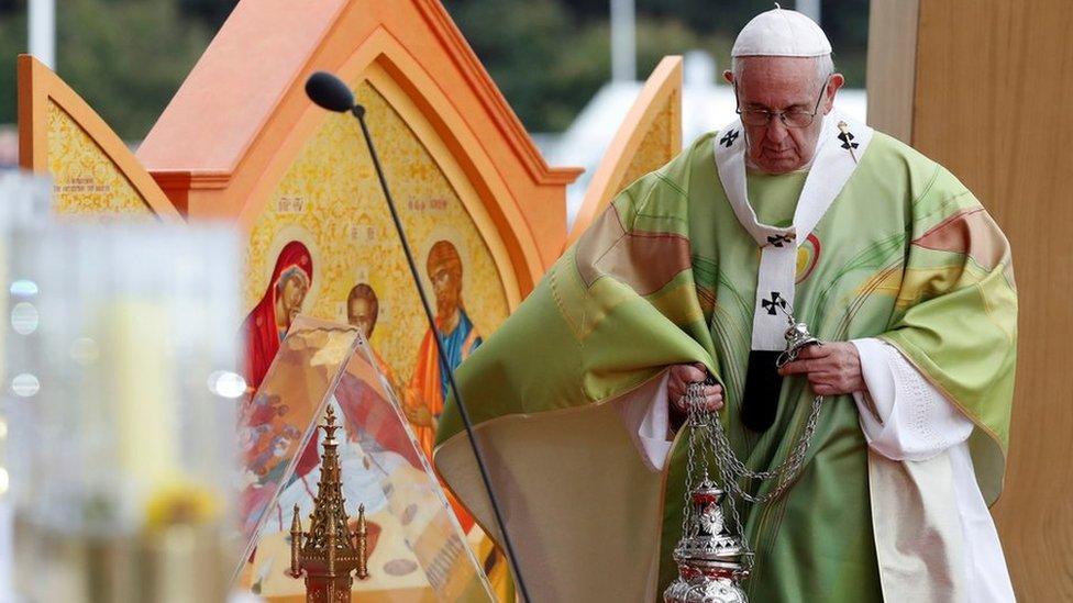 pope holding chalice