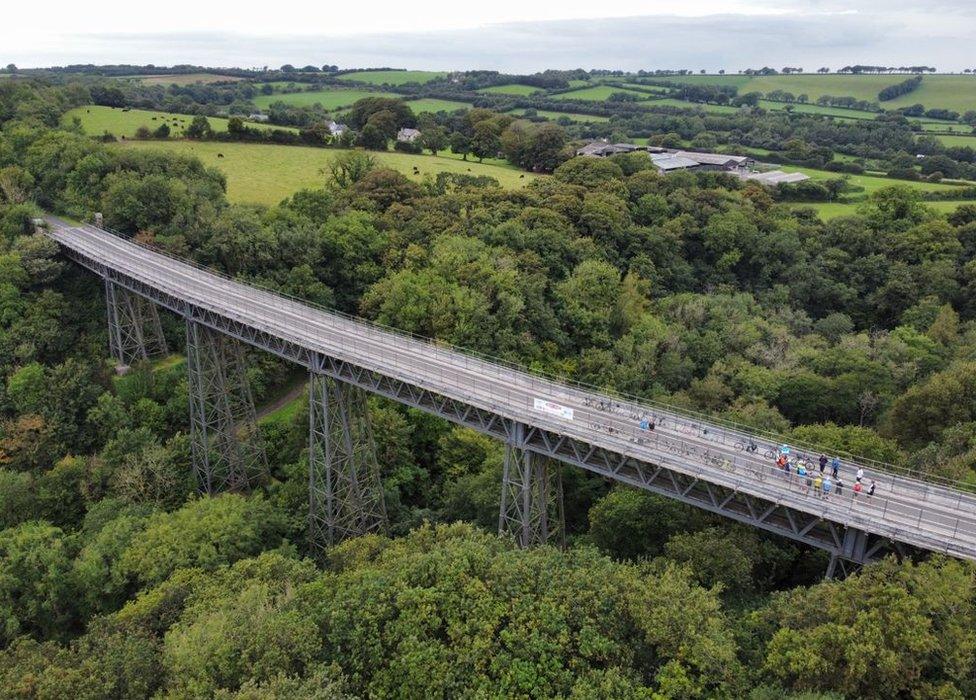 Cyclists on Meldon Viaduct in Devon