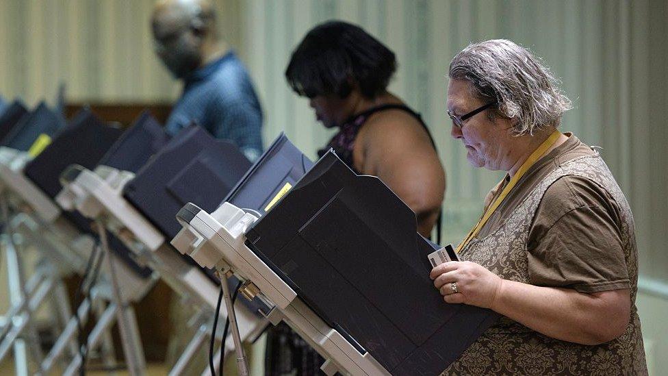 US voters using electronic voting machines