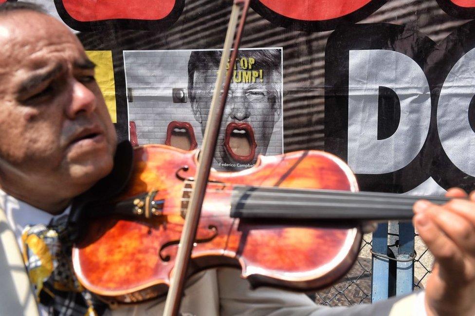 Protester plays violin