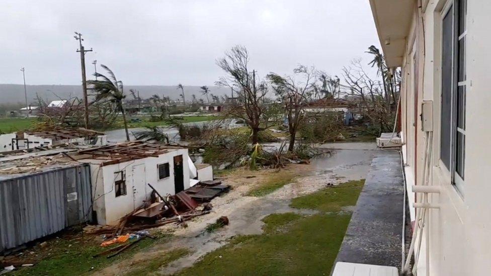 Debris, trees and building damage in Tinian