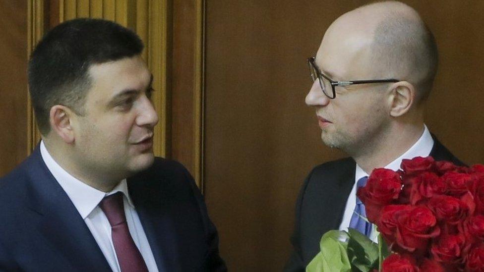 Prime Minister Arseniy Yatsenyuk, (right) and Parliament Speaker Volodymyr Groysman celebrate after Mr Yatsenyuk was appointed prime minister during the opening first session of the Ukrainian parliament in Kiev (27 November 2014)