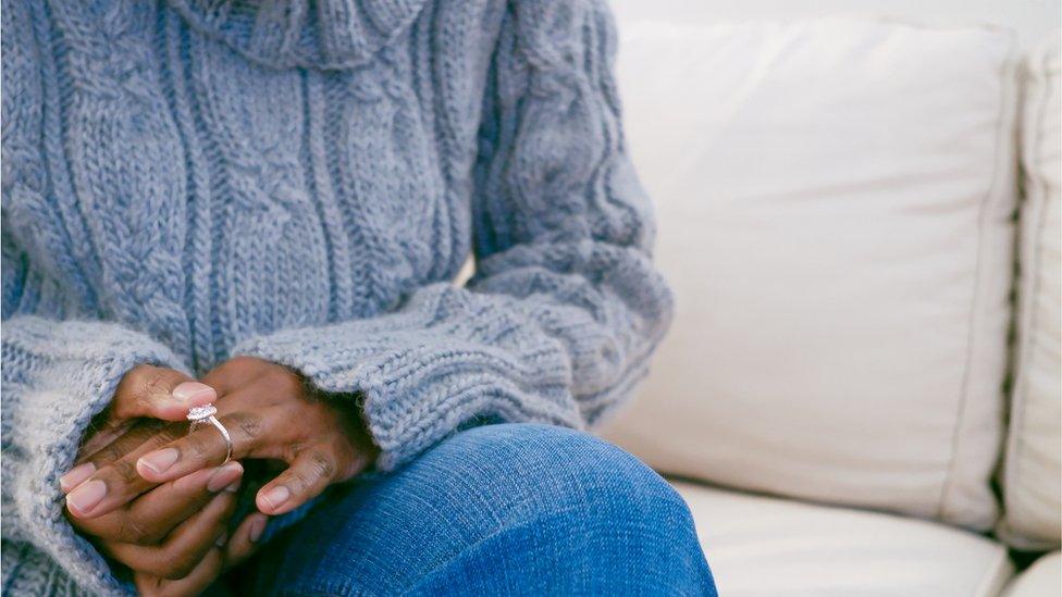 Woman playing with wedding ring