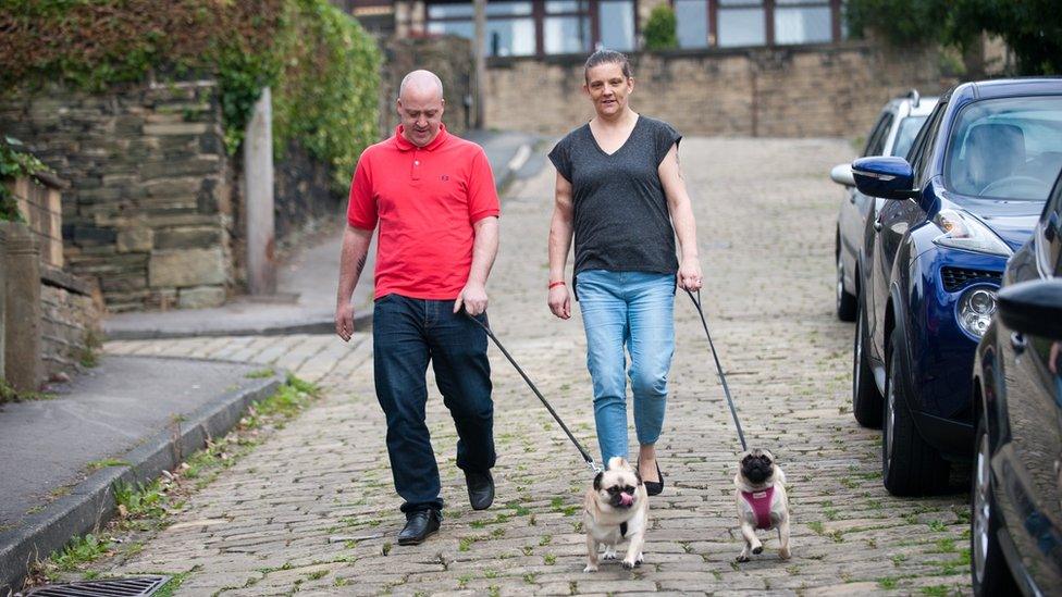 Mandy and John walk their dogs near their home in Huddersfield