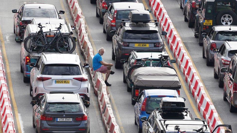 A man is stuck in traffic at Dover