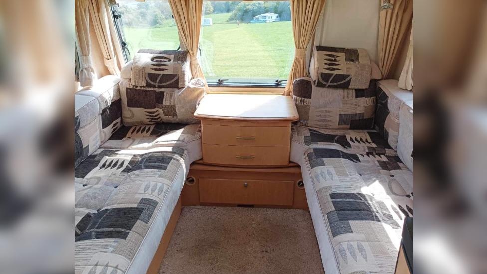 The inside of the caravan showing the seating area