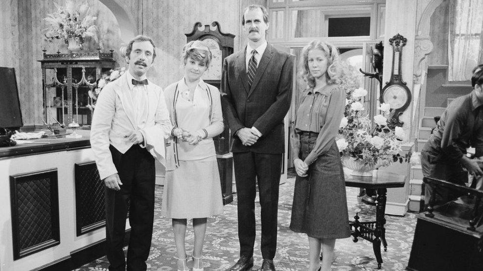 Andrew Sachs, Prunella Scales, John Cleese, Connie Booth on the set of Fawlty Towers in 1975