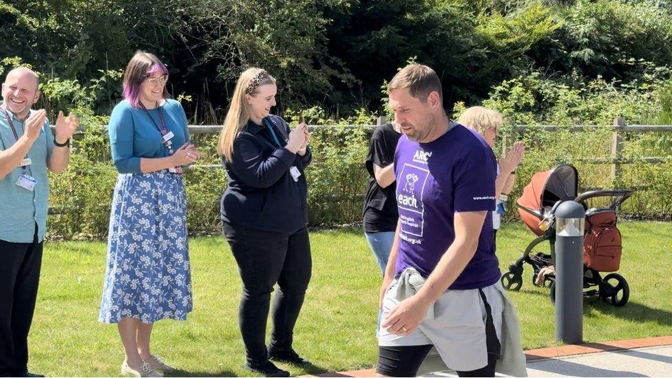 Grant Holt completing a charity walk