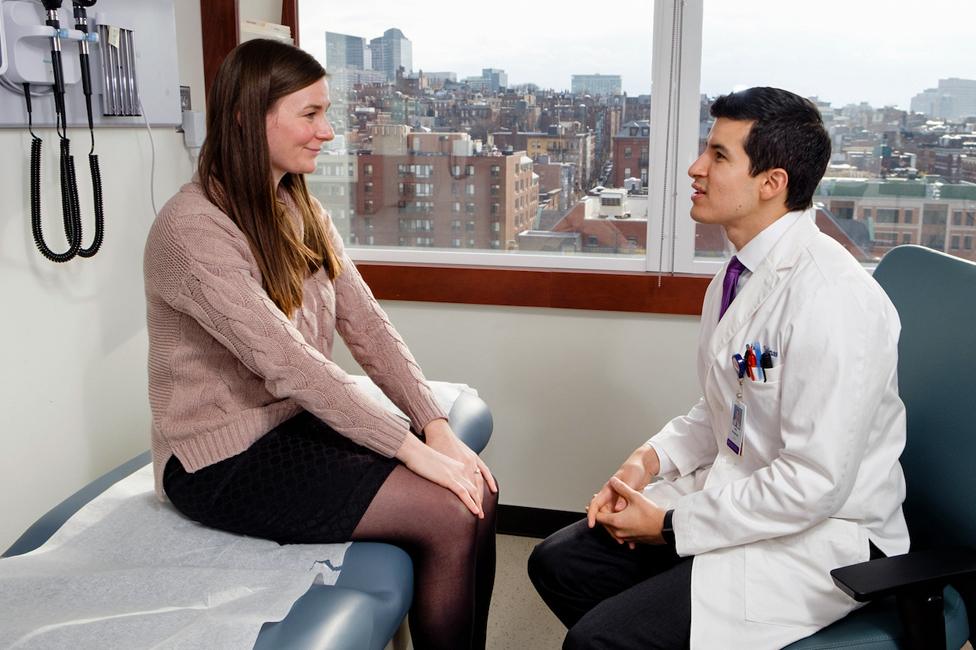 Dr Joel Salinas talks to a patient