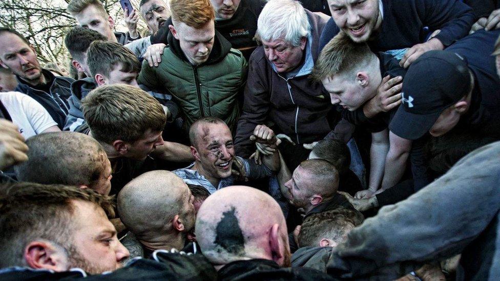 Michael Adcock in a crowd of people