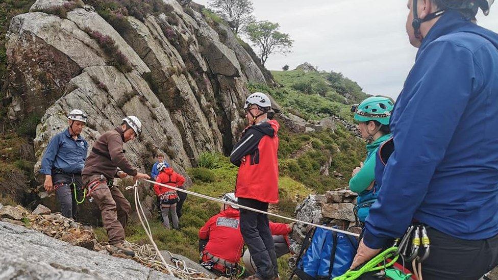 rescue team members with ropes