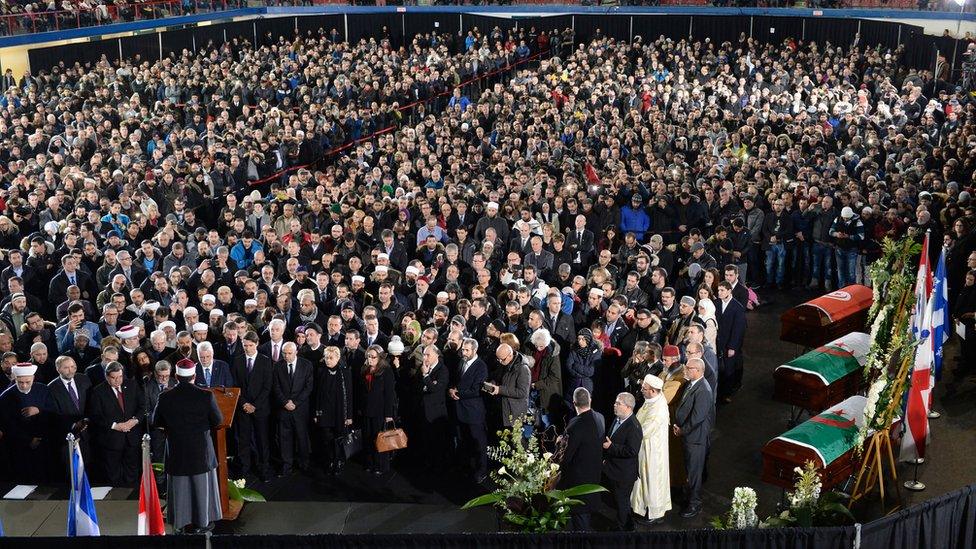 Hassan Guillet delivers the eulogy at the funeral for Abdelkrim Hassane, Khaled Belkacemi and Aboubaker Thabti