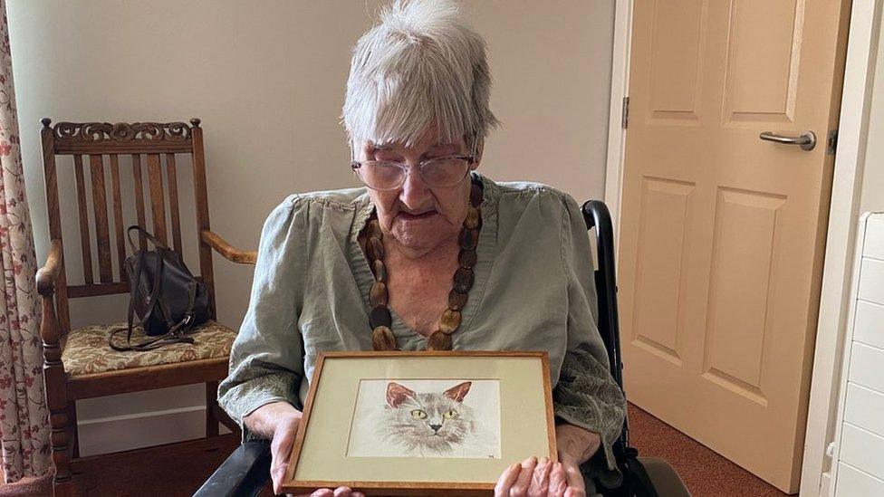 Meriel Everett with her painting of a cat