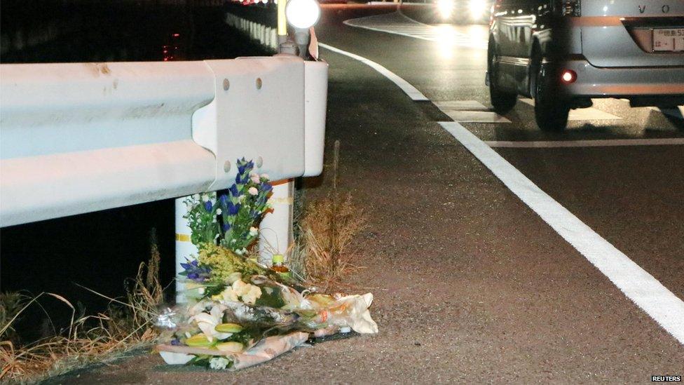 Tribute flowers at the side of the road