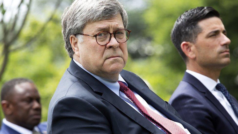 William Barr listens to President Donald Trump in the Rose Garden of the White House (16 June 2020)