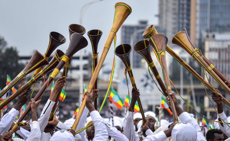 Believers play instruments during the Meskel celebrations, a religious holiday held by the Ethiopian Orthodox Church in Addis Ababa, on September 27, 2019.