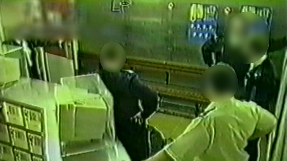 Christopher Alder lying on floor of a Hull custody suite with police officers standing around