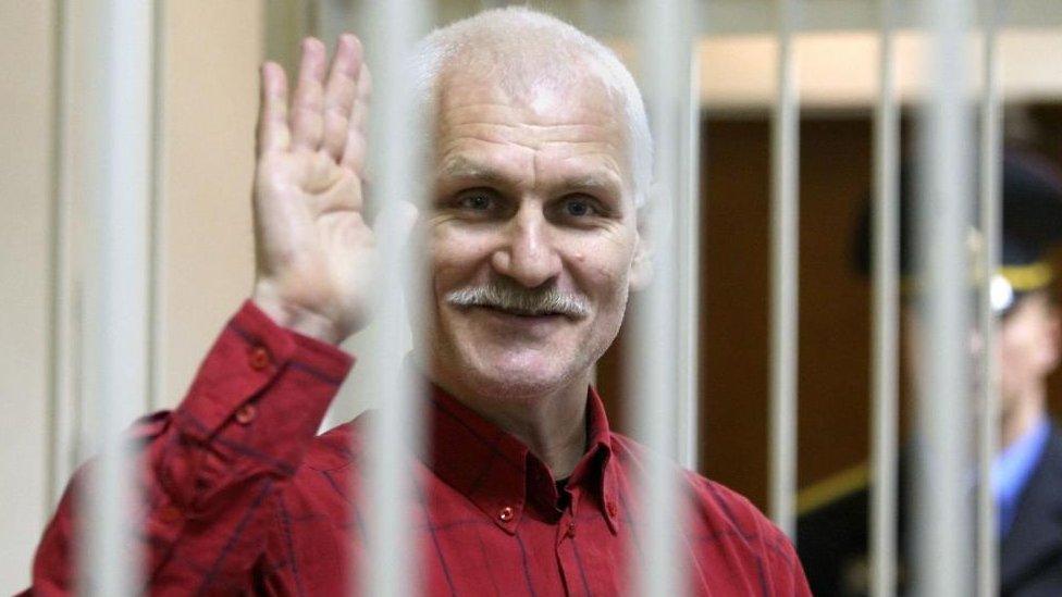 Ales Bialiatski pictured waving in November 2021