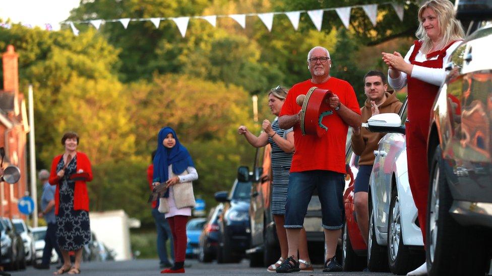 Local residents applaud the NHS and other key workers on May 7, 2020 in Northampton, United Kingdom