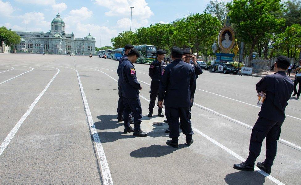 Picture of Thai policemen guarding a plaque in Bangkok in April 2017