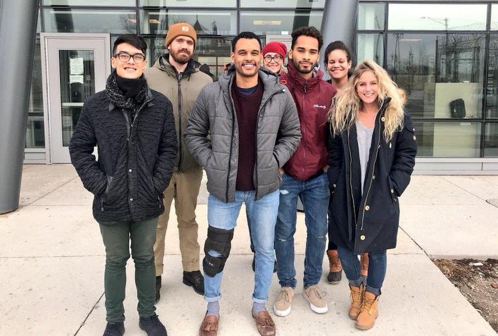 A team from Chicago Votes stand outside the jail building