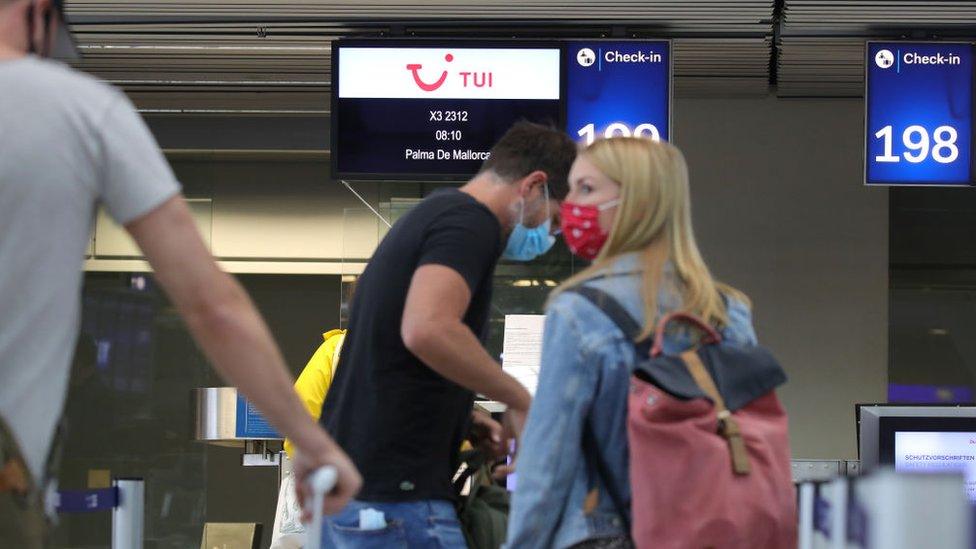 People check in for a Tui flight from Dusseldorf to Mallorca in June