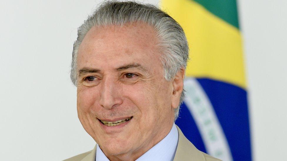 Brazilian acting President Michel Temer gestures during the presentation of new ministers at Planalto Palace in Brasilia on May 18, 2016.