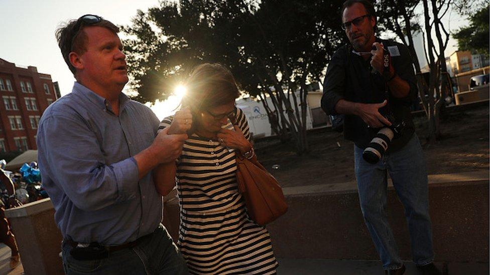 News photographer at Dallas shooting