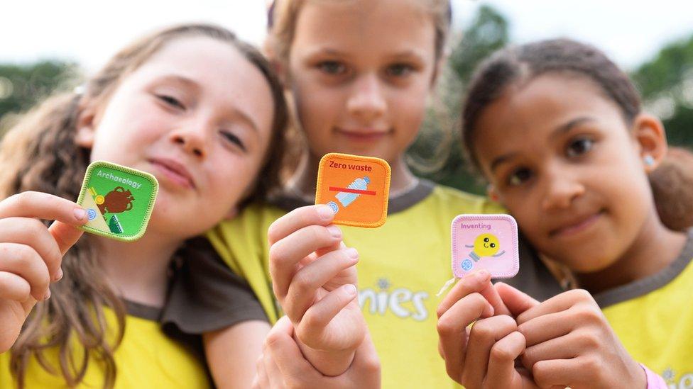 Brownies holding the new badges