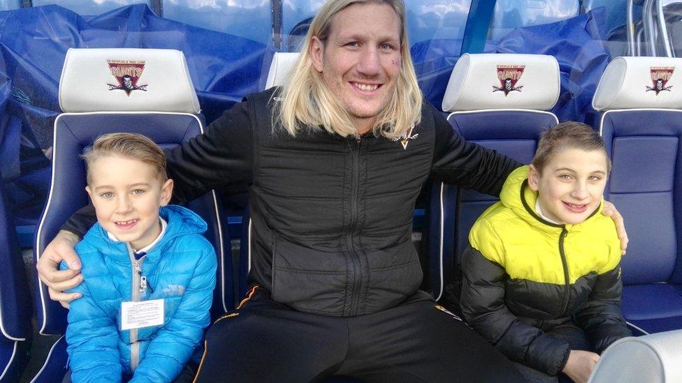 Rugby player Eorl Crabtree with Benji, and his brother, Daniel