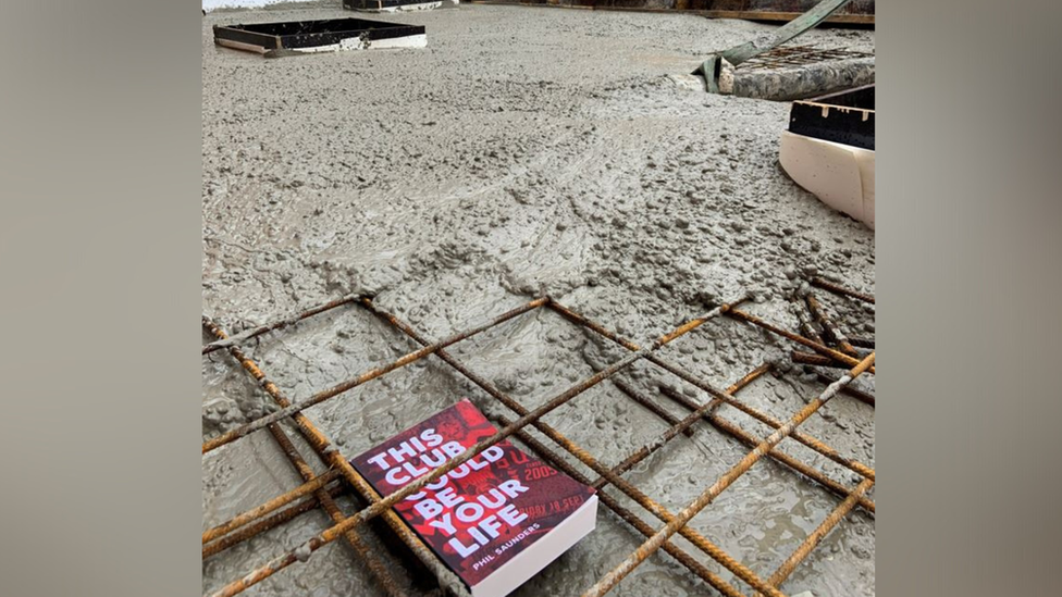 Phil Saunders' book is buried in concrete