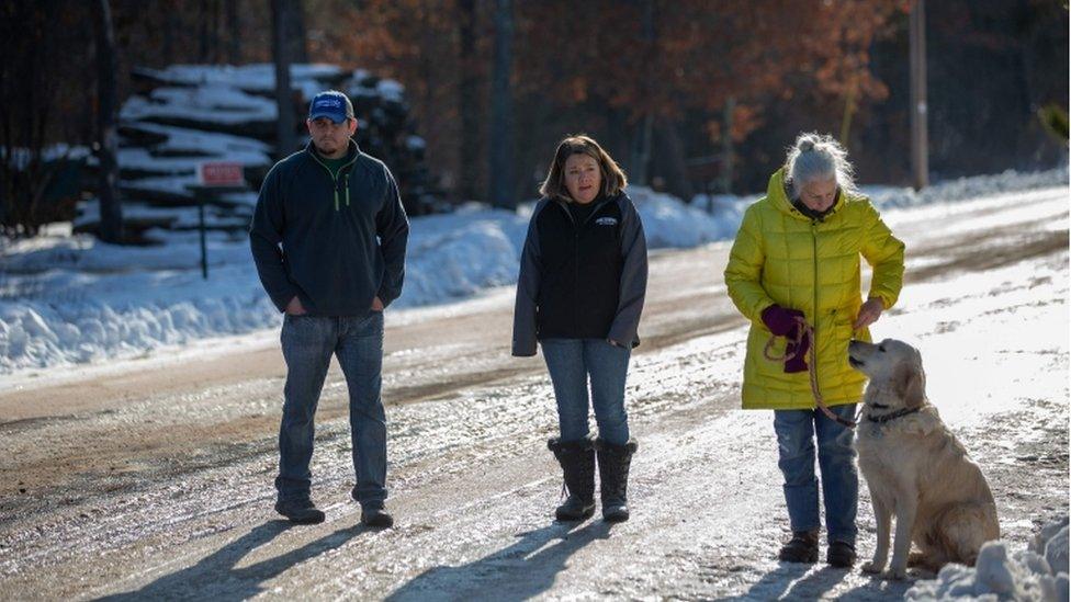 Peter and Kristen Kasinskas and Jeanne Nutter with her dog spoke to reporters outside their neighbourhood, where Jayme was found