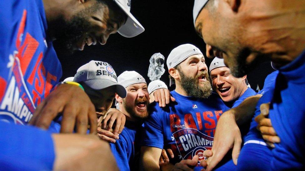 The Chicago Cubs celebrate in Chicago, 22 October