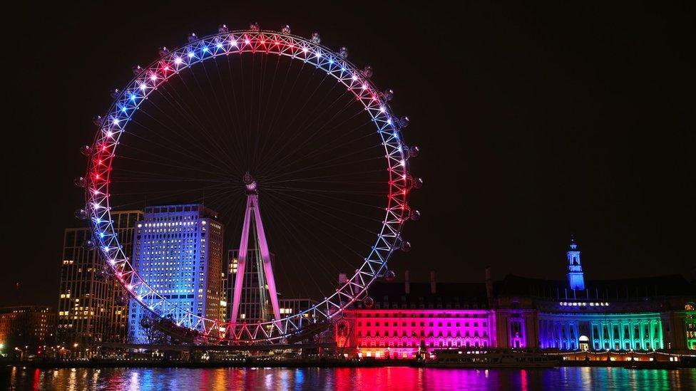 The London Eye and buildings along the South Bank are lit up with the colours of the Union flag, during a nationwide clap in honour of Captain Sir Tom
