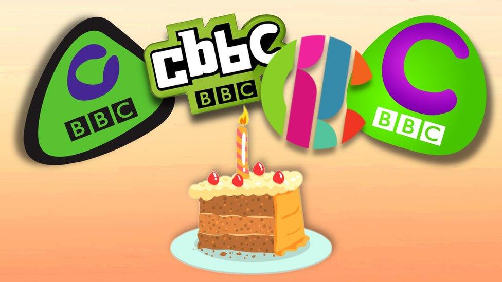 CBBC logos in front of a cake.