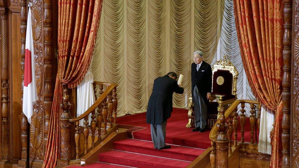 The Emperor hands over his speech document to the Speaker of the Lower House after delivering a speech during the opening ceremony of the 191st extraordinary Diet session in Tokyo, 1 August 2016.